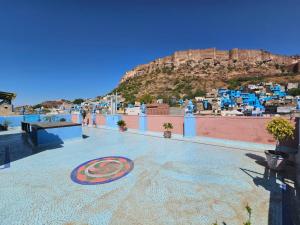 a large tile floor with a spiral design on the ground at Khamma Heritage in Jodhpur