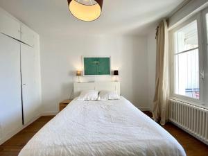 Posteľ alebo postele v izbe v ubytovaní Appartement proche plage avec vue mer