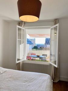 Posteľ alebo postele v izbe v ubytovaní Appartement proche plage avec vue mer
