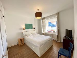 Posteľ alebo postele v izbe v ubytovaní Appartement proche plage avec vue mer