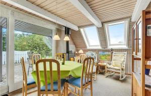 a dining room with a table and chairs at Gorgeous Home In Broager With Wifi in Broager