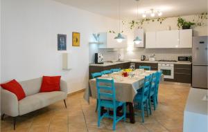 a kitchen and dining room with a table and chairs at Nice Home In Macerata With Wifi in Macerata