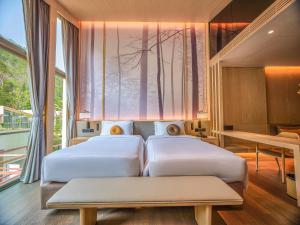 Hotel MYS Khao Yai客房内的一张或多张床位