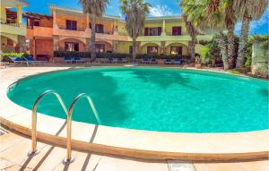 a large swimming pool in front of a building at Mono 2 in Palau