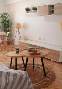 a living room with a coffee table and a couch at Monela Front beach sólo familias in Playa de Gandia