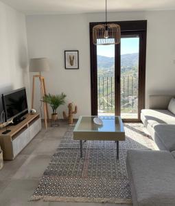 Televízia a/alebo spoločenská miestnosť v ubytovaní Vista DIMAS 03 , Frigiliana