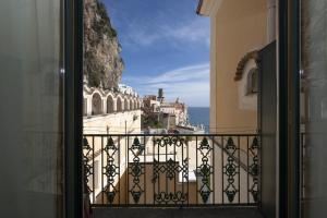 a view of the ocean from a balcony at La casa di Carmela - Amalfi Coast in Atrani