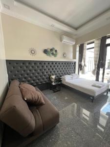 Llit o llits en una habitació de Dampa Poolside Events & Accommodation