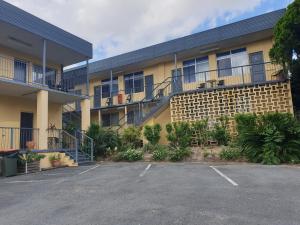 a parking lot in front of a building at Park Drive Motel in Kempsey