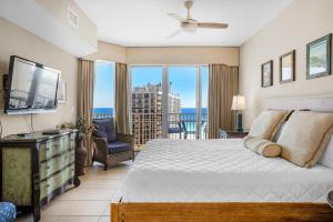 a bedroom with a bed and a view of the ocean at Ariel Dunes I 1401 in Destin +50 photos