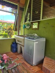 a small bathroom with a sink and a toilet at Casa El Jardín in Piedras