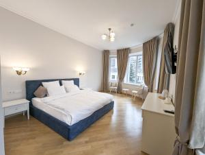 Postel nebo postele na pokoji v ubytování Kyiv Honchara Hotel