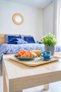 Postel nebo postele na pokoji v ubytování Logement Noah