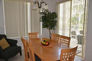 a dining room table with a bowl of fruit on it at 4 Bed 3 Bath 448 Birkdale, overlooks golf course, home in Davenport