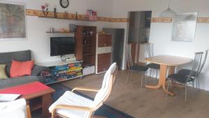 a living room with a couch and a table and chairs at Ferienwohnung - a69392 in Missen-Wilhams