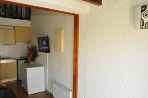 TV a/nebo společenská místnost v ubytování Cap d'Agde Naturiste - Heliovillage