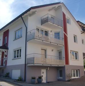 a large white building with balconies on it at Haus-Fechtig-Wohnung-TypB-Parterre in Bonndorf im Schwarzwald