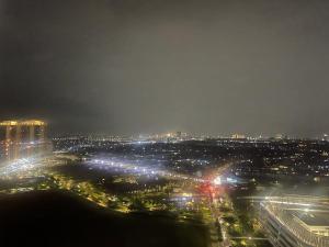 a view of a city at night with lights at APARTEMEN SKY HOUSE BSD in Samporo