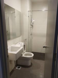 a bathroom with a toilet and a sink and a shower at SL TR Homstay in Cameron Highlands