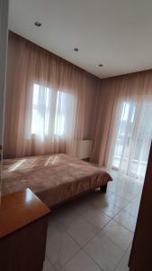 Кровать или кровати в номере La Casa Delle Vacanze
