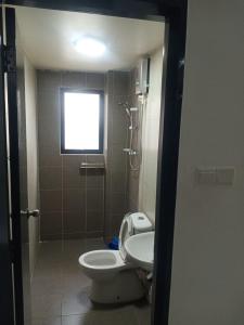 a bathroom with a toilet and a shower and a sink at Pangkor L29, Dream Island Homestay in Kampong Sungai Udang +38 photos