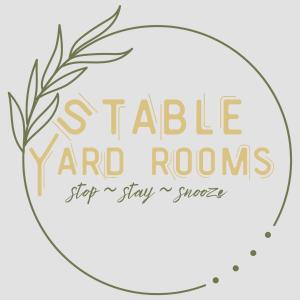 a circle with the words s table yard rooms and rooms get a stay aasy at Stable Yard Rooms in Richmond