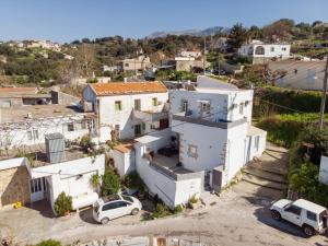 an aerial view of a white house at Avli Village Home with Outdoor Jacuzzi in Vafés