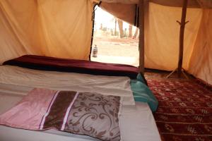 Postel nebo postele na pokoji v ubytování Bivouac Joudour Sahara + 37 fotografií