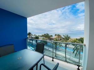 a balcony with a table and a view of the beach at Mar Azul in La Manga del Mar Menor