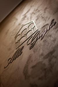 a close up of the name of a car at Alle Guglie Boutique Hotel in Venice