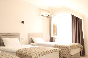 Voodi või voodid majutusasutuse Aventus Hotel toas