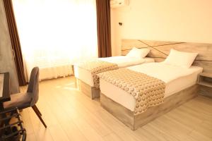 Voodi või voodid majutusasutuse Aventus Hotel toas
