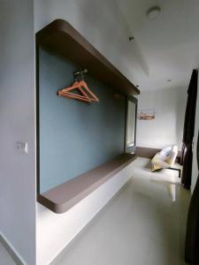 a room with a wall with a bench in it at Meridin Medini Sovo, Iskandar Puteri, Johor in Nusajaya