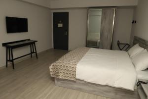 Voodi või voodid majutusasutuse Aventus Hotel toas