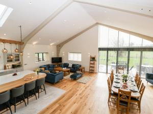 a kitchen and living room with a table and chairs at Bilsham Meadows in Bristol