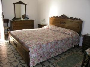Giường trong phòng chung tại casa ottocentesca nel borgo
