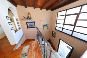 a staircase in a home with a large window at Villa Nikolina in Molat