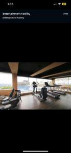 a picture of a gym with treadmills and chairs at Student park apartment in Seturan