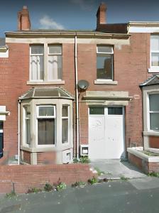 a brick house with a white door and windows at Saltwell St - Delightful 3 Bedroom free parking free wifi in Gateshead