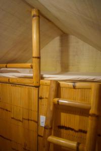an inside of a sauna with two woodenunks at GoOd Inn White Beach Moalboal in Cebu City