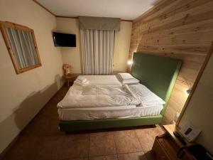 Postel nebo postele na pokoji v ubytování Hotel Trieste