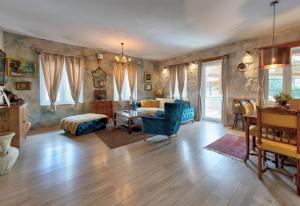 a living room with a couch and a table at Apartments Villa Mike in Mostar