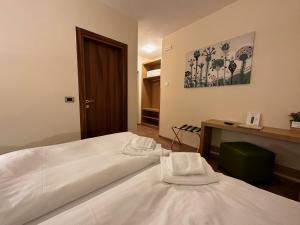 Postel nebo postele na pokoji v ubytování Hotel Trieste