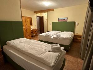 Postel nebo postele na pokoji v ubytování Hotel Trieste