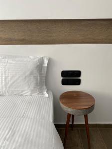 A bed or beds in a room at Athens Center Boutique Suites