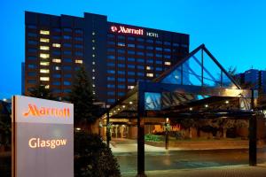 a hotel with a sign in front of a building at Glasgow Marriott Hotel in Glasgow