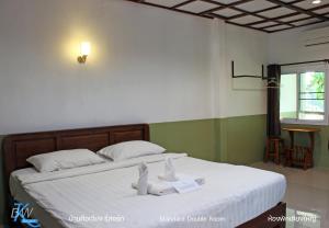Letto o letti in una camera di Baan Khue Wieng Resort