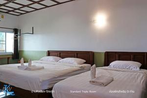 Letto o letti in una camera di Baan Khue Wieng Resort