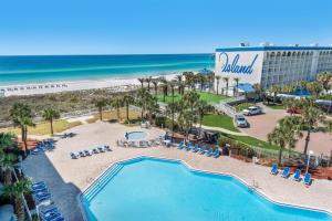 an aerial view of a resort with a pool and the beach at Destin West Gulfside #608 in Fort Walton Beach