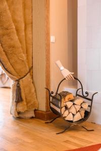 a hair dryer sitting in a basket on the floor at St.Jacobs's apartments Old Town Riga in Rīga